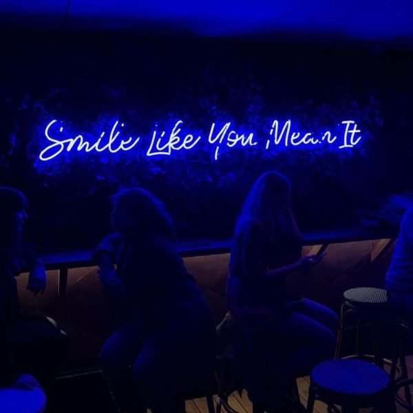 smile like you mean it neon sign